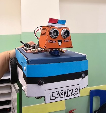 A handmade programmable robot car built during a robotics activity
